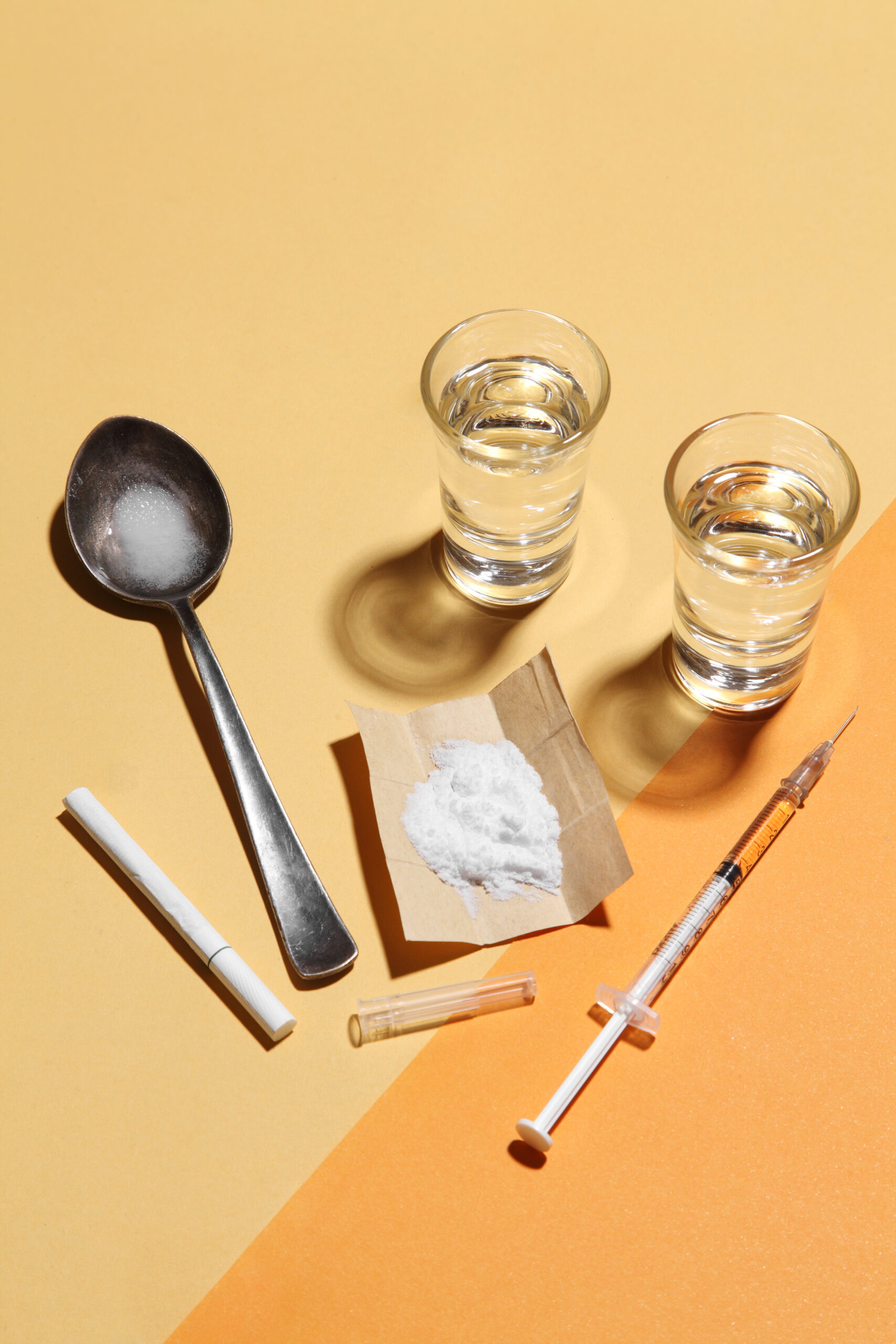 A picture of addicting items on a cream and orange background