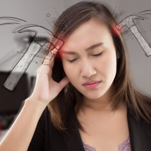 Woman in discomfort with highlights at her temples